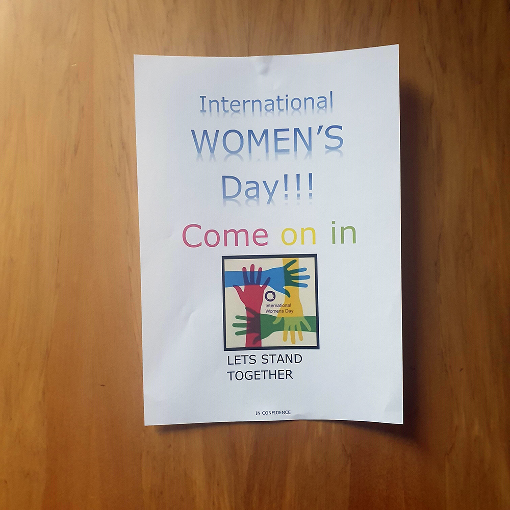 A poster to attend an IWD breakfast livestream in Nelson