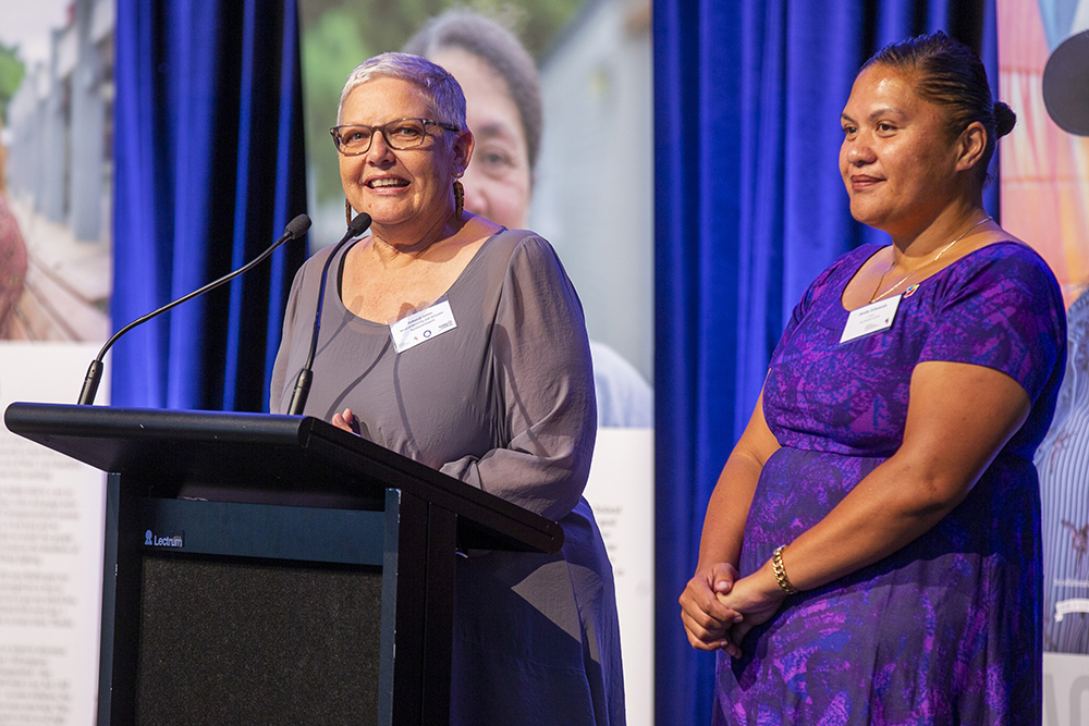 Deb James and Anita Edwards at the podium.