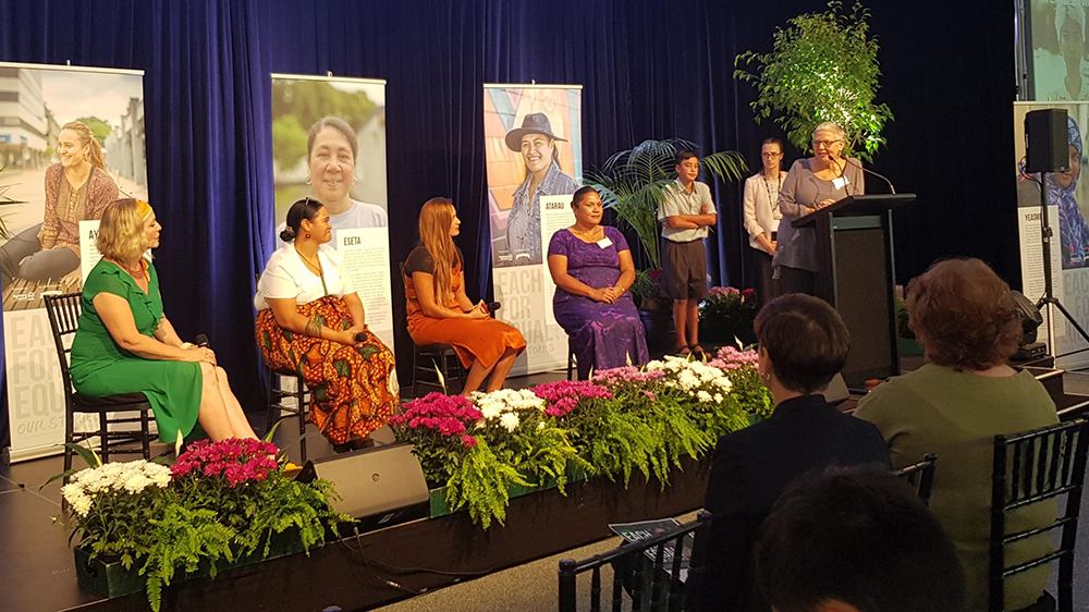 Deb James addresses the panel on stage.